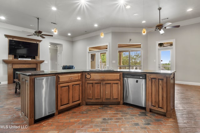 kitchen with a sink, brick floor, visible vents, and dishwasher