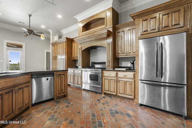 1400 Magnolia Bluff Dr, Gautier, MS 39553 - kitchen with stainless steel appliances, dark countertops, recessed lighting, crown molding, and brick floors