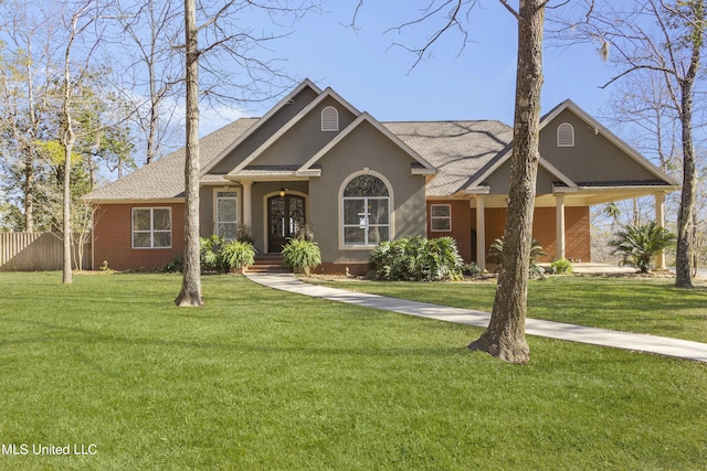 1400 Magnolia Bluff Dr, Gautier, MS 39553 - view of front of house with a shingled roof, stucco siding, and brick siding