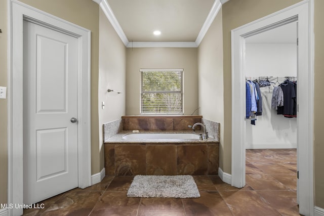 1400 Magnolia Bluff Dr, Gautier, MS 39553 - bathroom featuring ornamental molding, a bath, a walk in closet, and baseboards