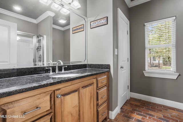 bathroom with brick floor, crown molding, vanity, and baseboards