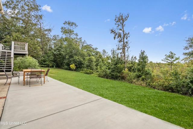 view of patio / terrace with a deck and stairway