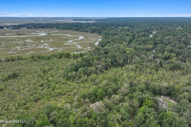 drone / aerial view featuring a forest view