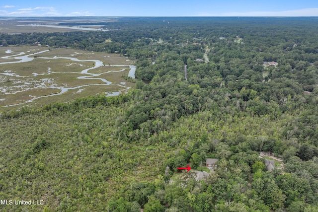 drone / aerial view featuring a view of trees