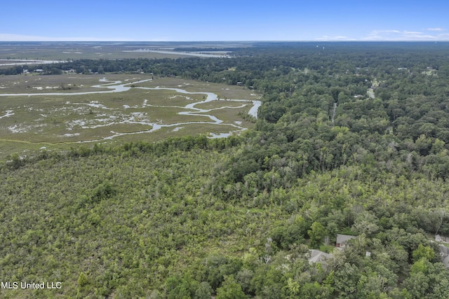 birds eye view of property with a view of trees