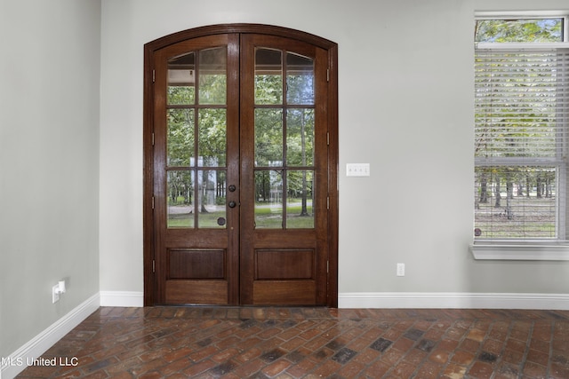1400 Magnolia Bluff Dr, Gautier, MS 39553 - entryway with baseboards, brick flooring, and french doors