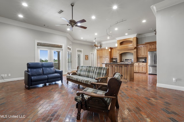 living room with baseboards, visible vents, and ornamental molding