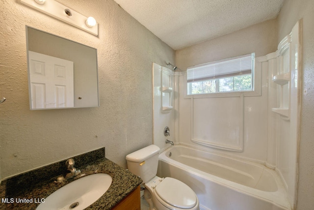 full bathroom featuring vanity, shower / bathing tub combination, a textured ceiling, and toilet