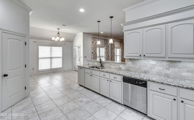 272 Hidden Hills Pkwy, Brandon, MS 39047 - kitchen with stainless steel dishwasher, a chandelier, decorative backsplash, lofted ceiling, and hanging light fixtures