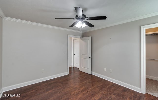 272 Hidden Hills Pkwy, Brandon, MS 39047 - unfurnished bedroom with ornamental molding, wood finished floors, a closet, a ceiling fan, and a walk in closet