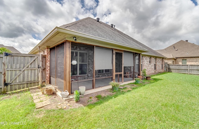 272 Hidden Hills Pkwy, Brandon, MS 39047 - rear view of property with a sunroom, a fenced backyard, roof with shingles, a gate, and brick siding