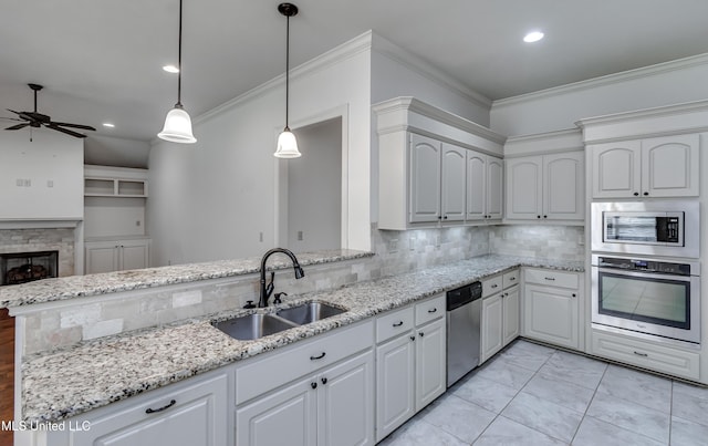 272 Hidden Hills Pkwy, Brandon, MS 39047 - kitchen with stainless steel appliances, a ceiling fan, decorative backsplash, crown molding, and light stone counters