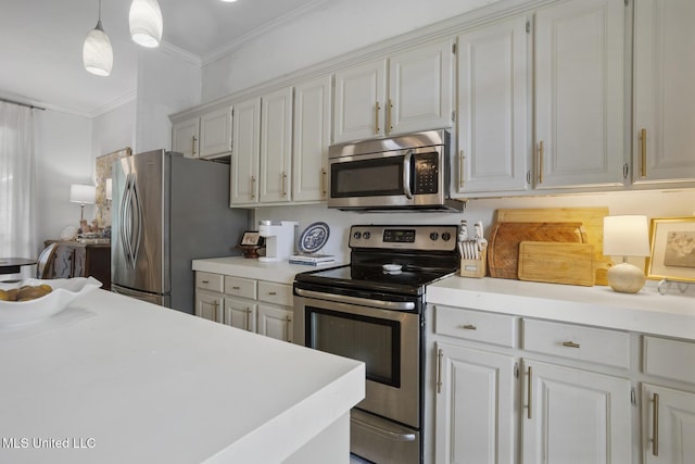 251 Greensview Dr, Brandon, MS 39047 - kitchen with stainless steel appliances, light countertops, ornamental molding, white cabinetry, and hanging light fixtures