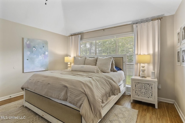 251 Greensview Dr, Brandon, MS 39047 - bedroom featuring wood finished floors, baseboards, and lofted ceiling