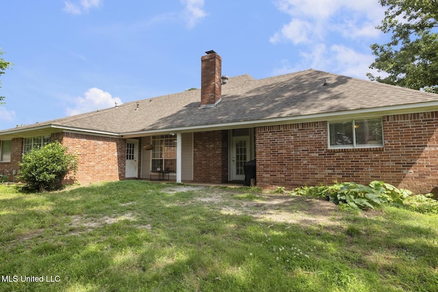 251 Greensview Dr, Brandon, MS 39047 - rear view of property featuring brick siding, a yard, a chimney, and a shingled roof