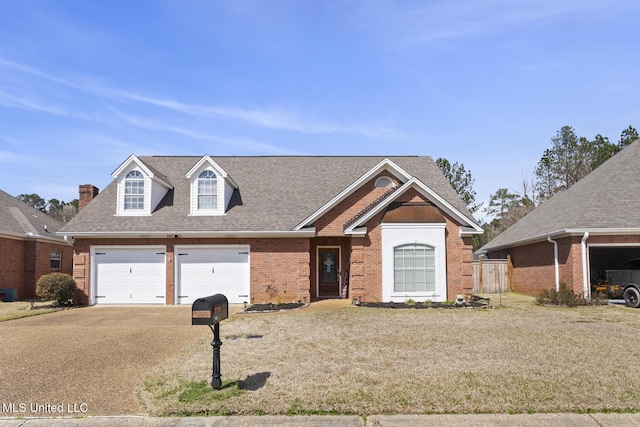 view of front of house with brick siding, concrete driveway, an attached garage, and a shingled roof