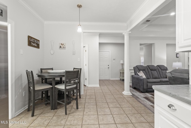 dining room featuring decorative columns, baseboards, light tile patterned floors, and ornamental molding