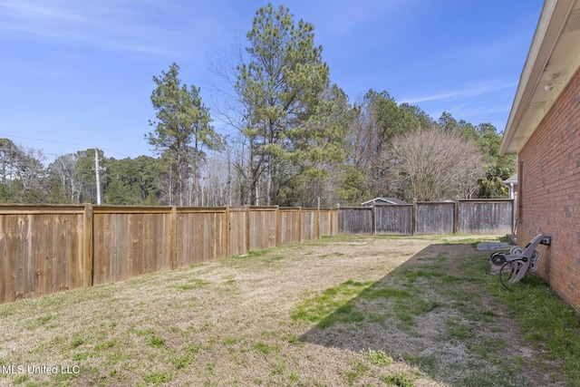 view of yard with a fenced backyard