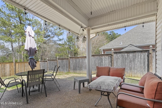 view of patio / terrace featuring outdoor dining area and a fenced backyard