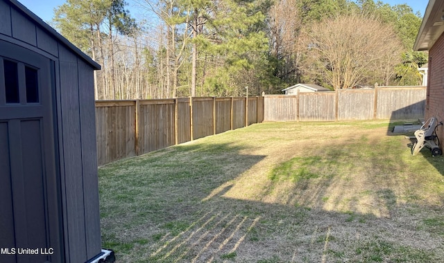 view of yard with a fenced backyard