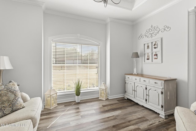 sitting room featuring crown molding, baseboards, and wood finished floors