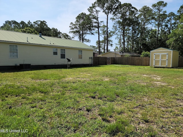 view of yard with a storage unit and cooling unit