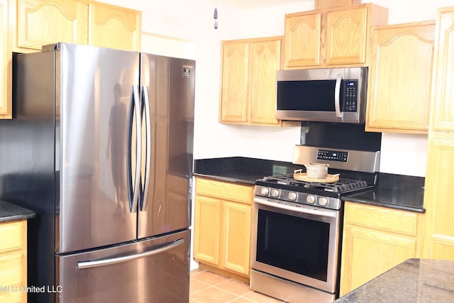 1154 E Old Pass Rd, Long Beach, MS 39560 - kitchen with stainless steel appliances, light brown cabinets, and light tile patterned floors