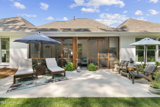 view of patio featuring a sunroom