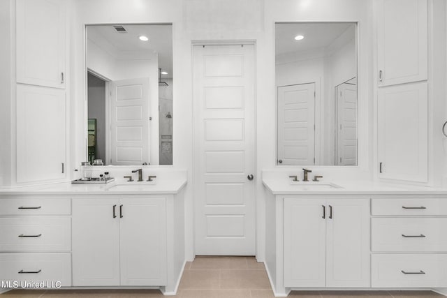 bathroom featuring tile patterned flooring and vanity