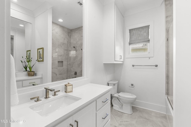 full bathroom featuring vanity, enclosed tub / shower combo, and toilet