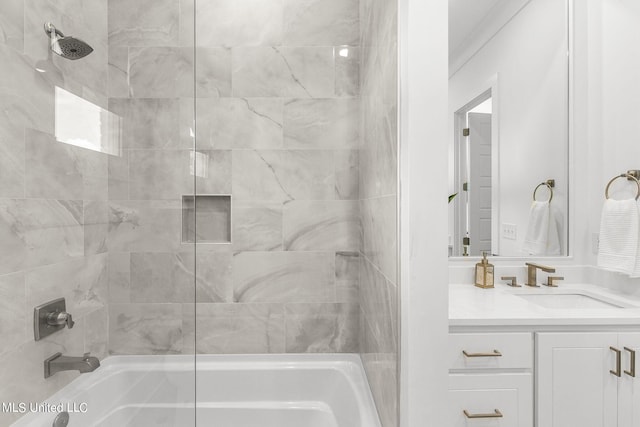 bathroom featuring vanity and tiled shower / bath combo