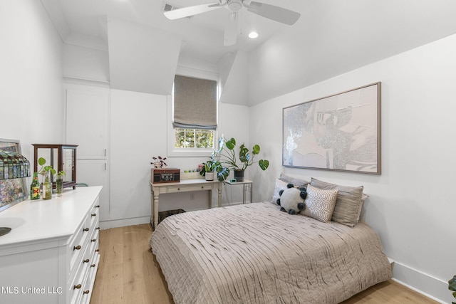 bedroom with ceiling fan and light hardwood / wood-style flooring