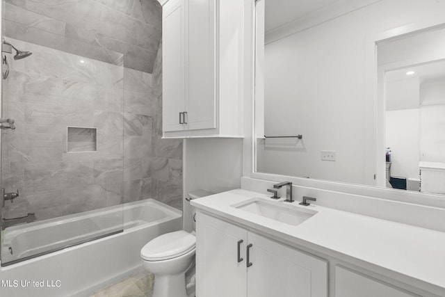 full bathroom featuring vanity, toilet, ornamental molding, and bathtub / shower combination