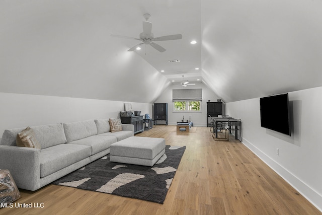 living room featuring light hardwood / wood-style flooring, ceiling fan, and lofted ceiling