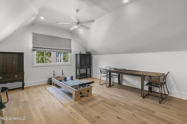 interior space featuring ceiling fan, light hardwood / wood-style floors, and vaulted ceiling