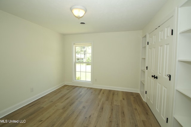 unfurnished room with light hardwood / wood-style flooring