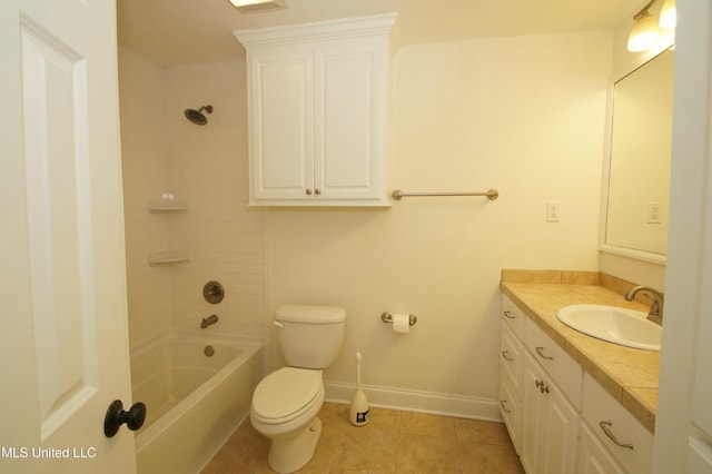 full bathroom featuring toilet, tiled shower / bath combo, tile patterned flooring, and vanity