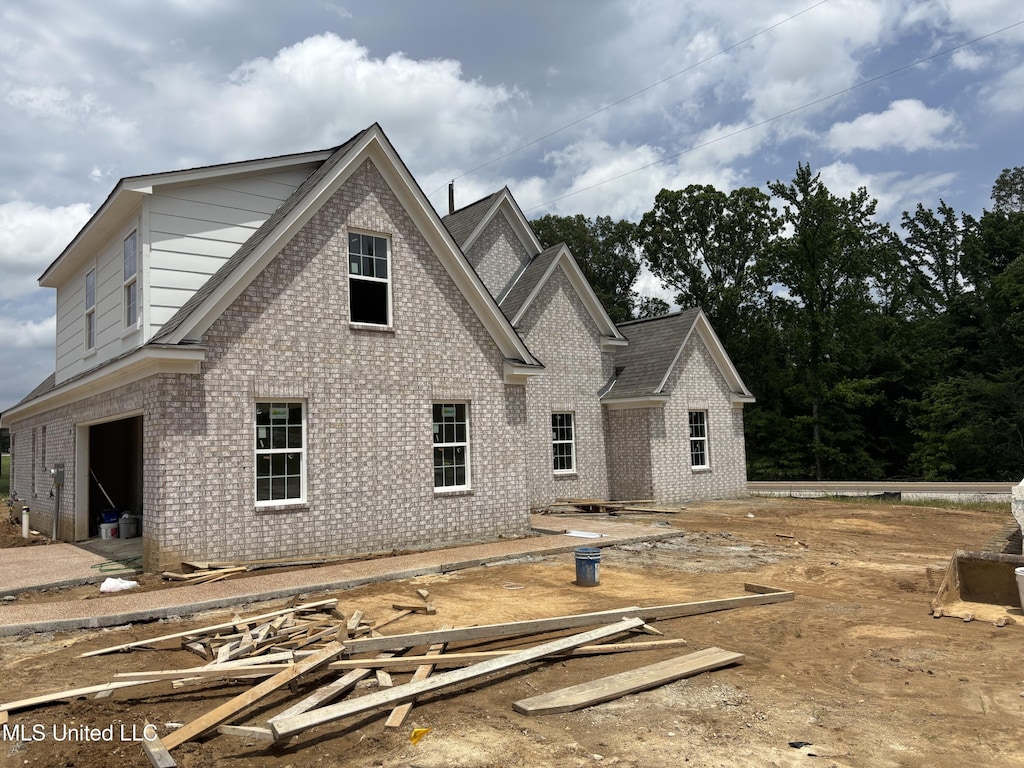 view of property exterior with brick siding
