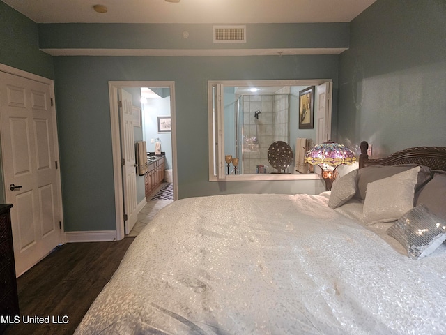 bedroom featuring dark hardwood / wood-style flooring