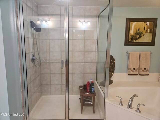 bathroom with independent shower and bath