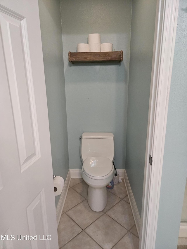 2668 Beach Blvd Unit 702, Biloxi, MS 39531 - bathroom with toilet, tile patterned floors, and baseboards