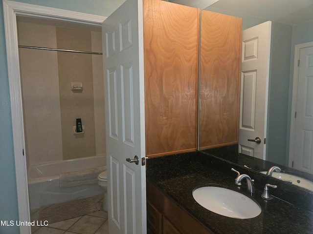 full bathroom with tile patterned flooring, vanity, toilet, and washtub / shower combination