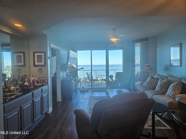2668 Beach Blvd Unit 702, Biloxi, MS 39531 - living room featuring ceiling fan, dark wood-style floors, and a textured ceiling