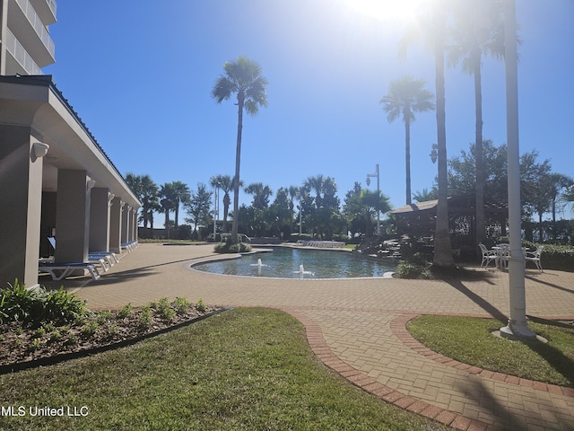 2668 Beach Blvd Unit 702, Biloxi, MS 39531 - view of swimming pool with a lawn