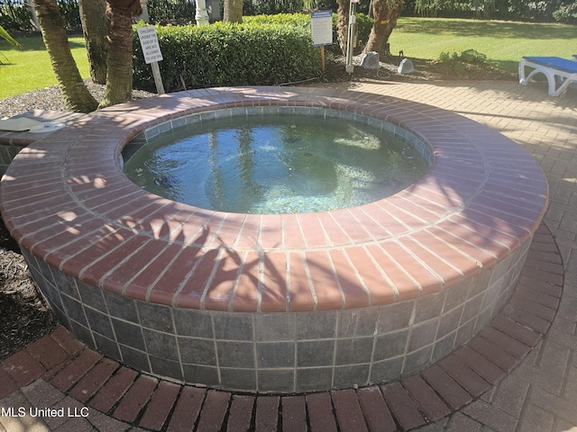 2668 Beach Blvd Unit 702, Biloxi, MS 39531 - view of swimming pool featuring a hot tub and a yard