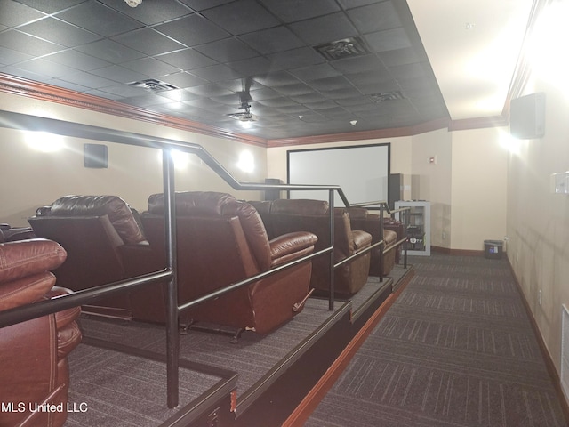 cinema featuring dark colored carpet and ornamental molding