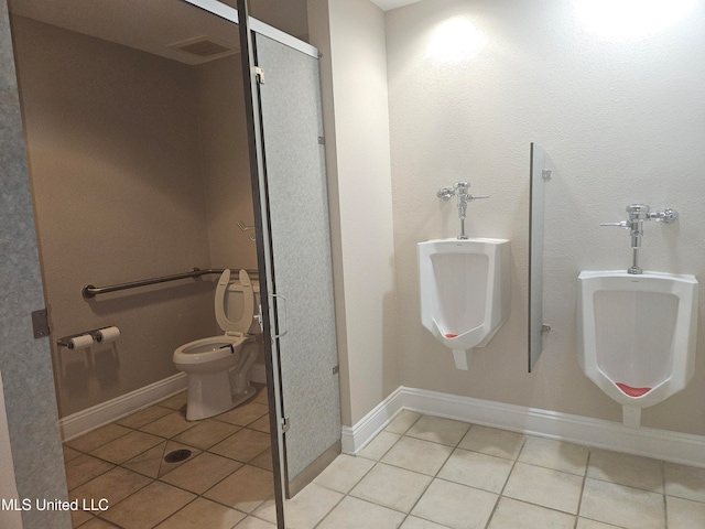 bathroom featuring tile patterned floors and toilet