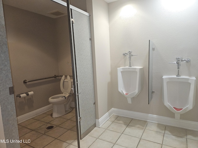 2668 Beach Blvd Unit 702, Biloxi, MS 39531 - bathroom with tile patterned floors, toilet, and baseboards