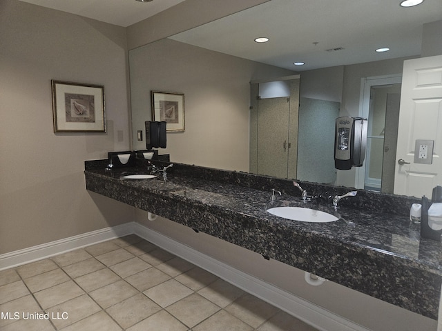 2668 Beach Blvd Unit 702, Biloxi, MS 39531 - full bathroom with baseboards, tile patterned floors, recessed lighting, double vanity, and a shower