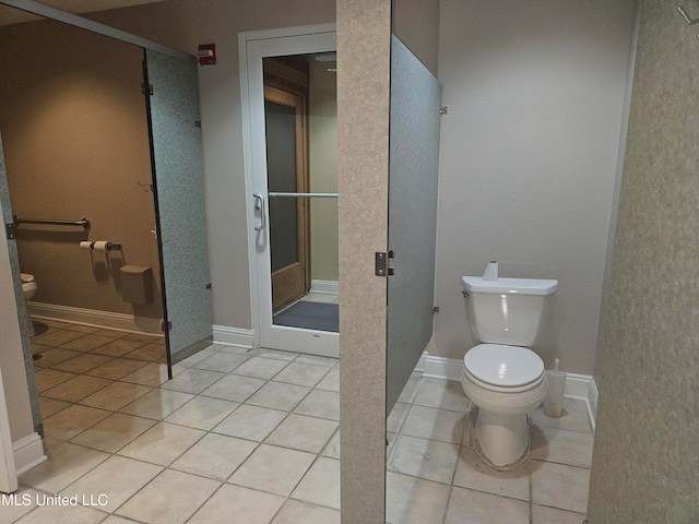 bathroom featuring tile patterned flooring and toilet